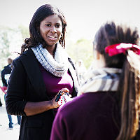 Dr. Pink talking to a student